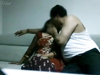 Indian Supermarket Employee cheats on her spouse with her boss on the sofa