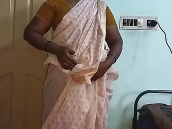 Hot MILF Mallu Aunty gets naked and finger-tickling be useful to the brush dad-in-law in a tourist house room