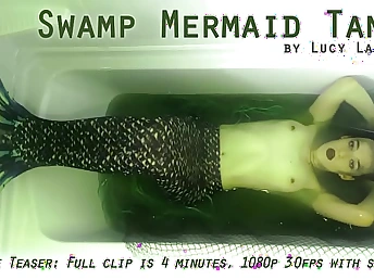 Lucy LaRue plays the role be advisable for a Swamp Mermaid Tank in a super-hot solo essay fun